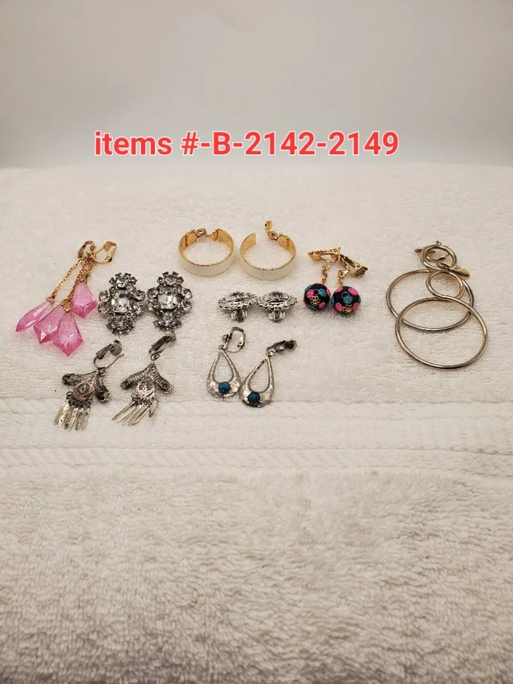 8 Pair of clip on Earrings, items # B-2142-2149, wt. 82 grams.